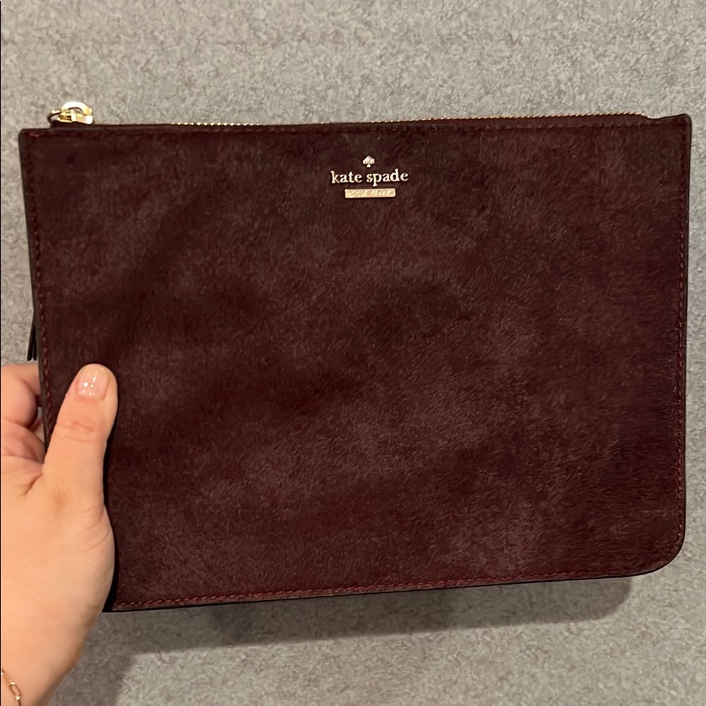 NWT kate spade burgundy suede pouch with gold logo